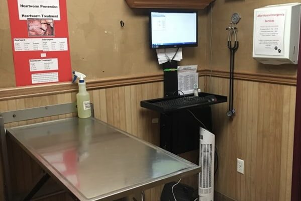 An exam room. Pictured is the exam table, and computer